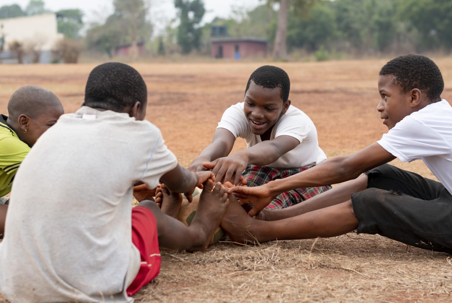 african-children-with-football-ball-sitting
